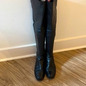 Stuart Weitzman 5050 black leather boots. Small rip on left boot.